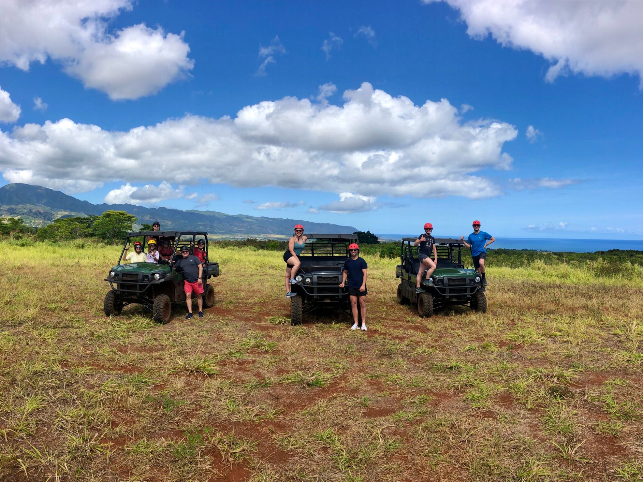 a group of parked motorcycles sitting on top of a grass covered field